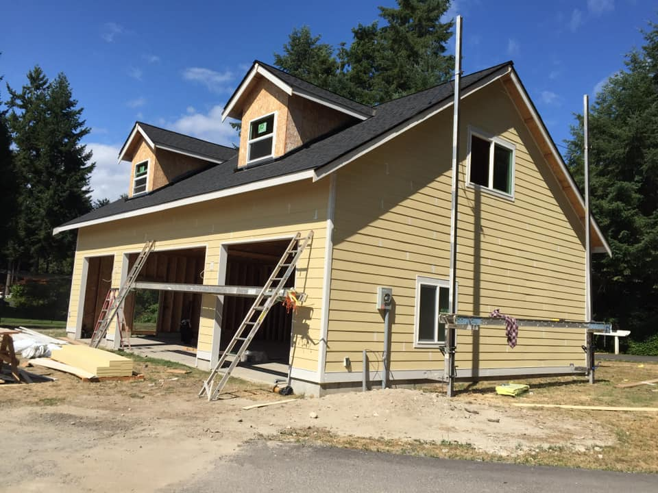 House with new lap siding and dormer windows during siding installation in Puyallup, WA